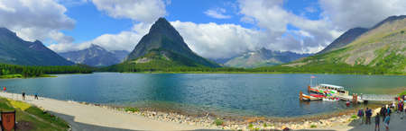 panoramic view of the swiftcurrent lake in Glacier National Park in summerの写真素材