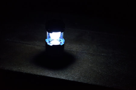 Closeup shot of the lantern on the table at night outdoors
