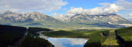 Beautiful high mountains of the Canadian Rockies reflecting in an alpine lake along the Icefields...