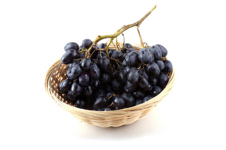 Grape on wicked plateの写真素材