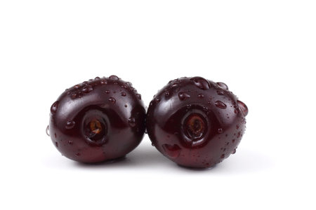 Red cherries isolated on white