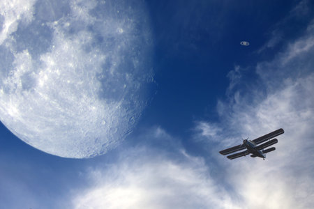 Moon, clouds and little airplane. Human and universe concept