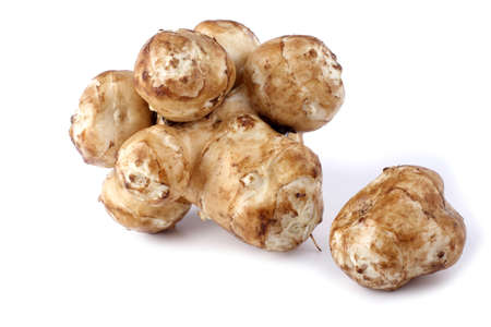 Jerusalem artichokes isolated on whiteの写真素材