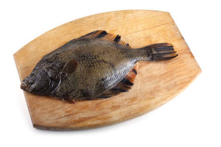 Marble flounder on cutting boardの写真素材