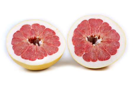 Pomelo halves isolated on white. Biggest citrusの写真素材