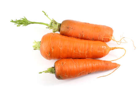 Three carrots isolated on whiteの写真素材