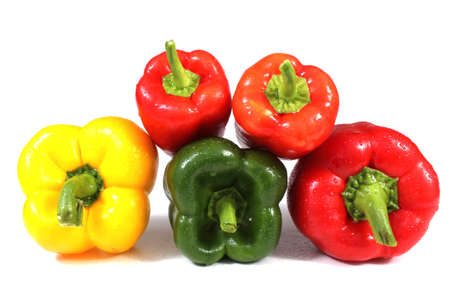 Different color sweet peppers isolated on whiteの写真素材