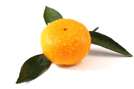 Mandarin orange with leaves isolated on whiteの写真素材