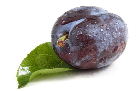Blue plum on leaf isolated on whiteの写真素材