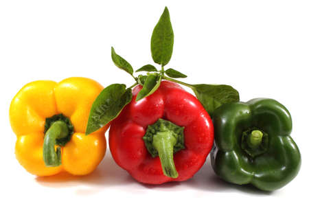 Different color sweet peppers isolated on whiteの写真素材