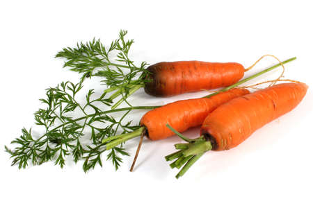 Three carrots isolated on whiteの写真素材