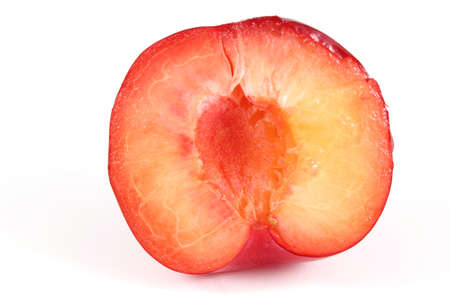 Red plum half isolated on whiteの写真素材