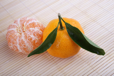 Mandarin oranges on bamboo background. Chinese style background
