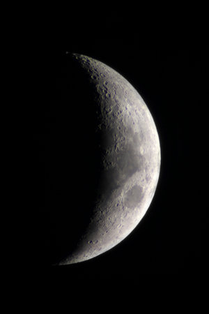 Crescent and black sky