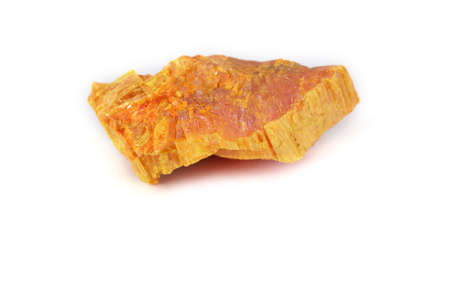 Auripigment (arsenic mineral) isolated on whiteの写真素材