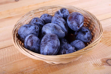 Black plums on tableの写真素材