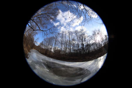 Frozen river in forest. Circular fisheye landscapeの写真素材