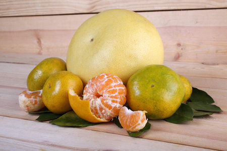 Pomelo and mandarin oranges on table