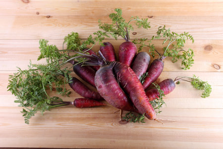 Red carrots on table