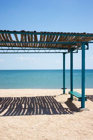 Sea water beach rest, landscape shelter from the sun, clouds skyの写真素材