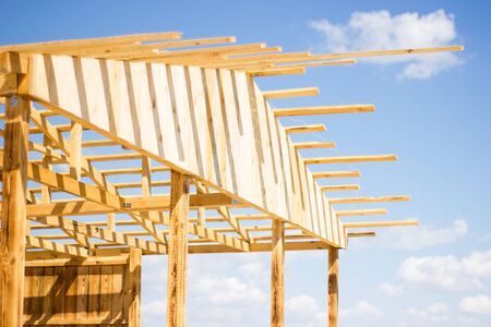Wooden natural house construction against the sky, nature protection, eco-friendlyの写真素材