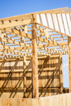 Wooden natural house construction against the sky, nature protection, eco-friendlyの写真素材