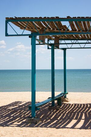 Sea water beach rest, landscape shelter from the sun, clouds skyの写真素材