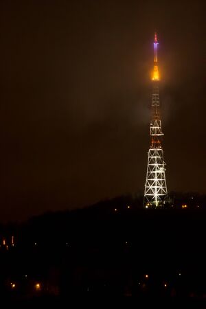 The lights of a television tower from a flight altitude - at nightの写真素材
