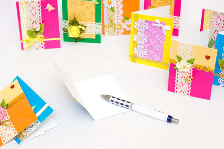 Beautiful varied handmade greeting cards - on a white backgroundの写真素材