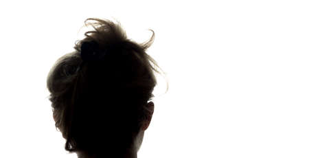Portrait of a young man, view from the back - silhouetteの写真素材