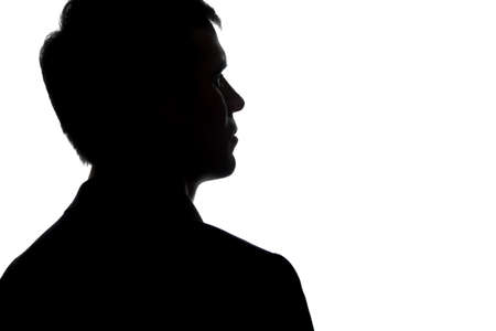 Portrait of a young man, view from the back - silhouetteの写真素材