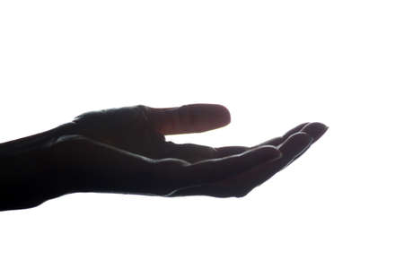 Women hand stretched forward with a request for assistance, alms, keeps the product - silhouetteの写真素材