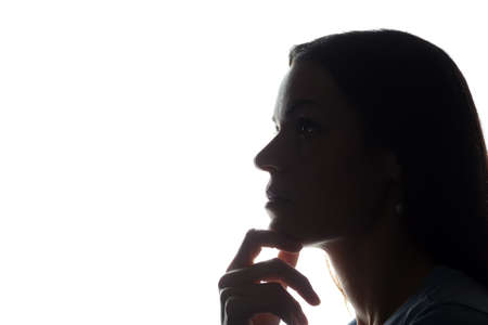 Portrait of a young woman, side view - horizontal silhouetteの写真素材