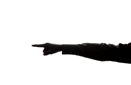 The man's hand points to the side with the index finger - silhouette