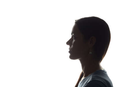 Young woman look ahead - horizontal silhouette of a side viewの写真素材