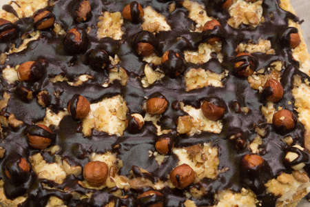 Cake with hazelnuts, cream and chocolate - texture, backgroundの写真素材