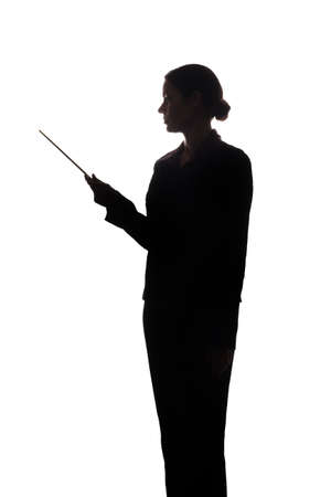 Young woman in suit look ahead and shows pointer forward - silhouetteの写真素材