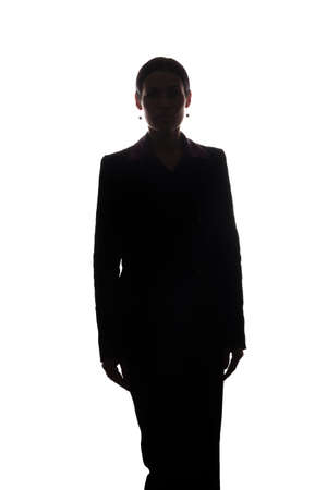 Young woman in suit look ahead - silhouetteの写真素材