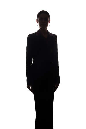 Young woman in suit look ahead - silhouetteの写真素材