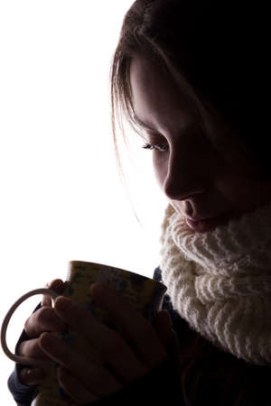Silhouette of a young woman with a cup - horizontal, isolatedの写真素材
