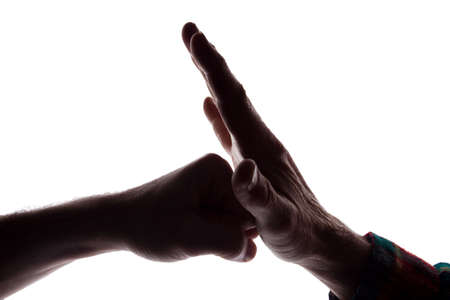 Male hands young and old together cooperation - silhouette, isolateの写真素材