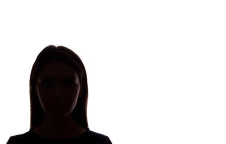Young woman look ahead with flowing hair - silhouette of a front view