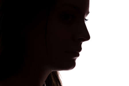 Silhouette of a young woman with problems - horizontal, isolatedの写真素材