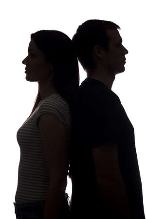 Faces women and men look in different directions, brother and sister - vertical silhouetteの写真素材