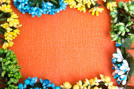 Frame of bright artificial flowers - multi-colored, beautiful background