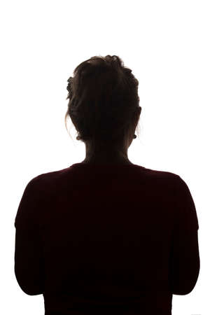 Silhouette of a young girl from behind with a haircut - isolated, nonameの写真素材