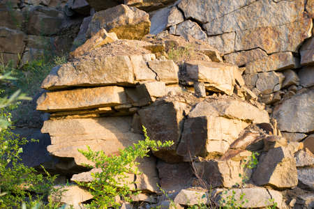 Texture of a large granite rock made of stones - marble stone quarry backgroundの写真素材