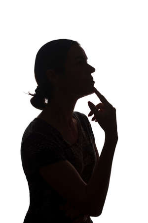 Portrait of a young woman, pensive, thinking side view - silhouette, isolatedの写真素材