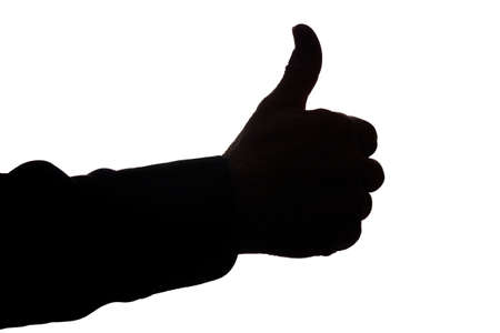 Hand of a old man with a raised finger, like and approval - silhouette concept abstractionの写真素材
