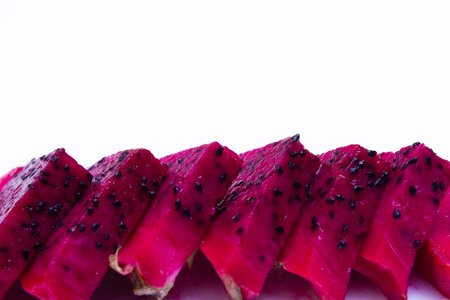 Juicy cut fruits of edible dragon fruit cactus, pitahaya - on white background, texture close upの写真素材